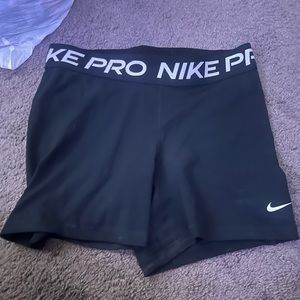 black nike pros size large a bit worn in but still good condition!